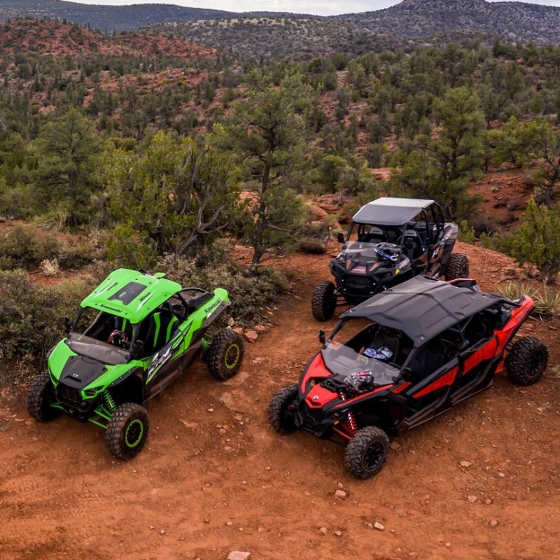 a car driving down a dirt road