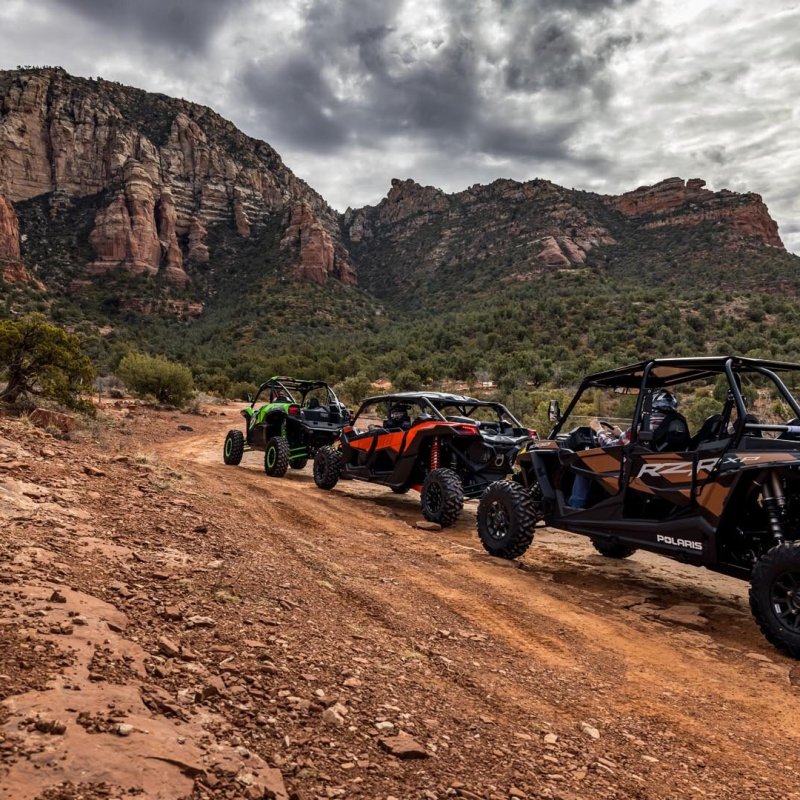 a motorcycle is parked on the side of a mountain