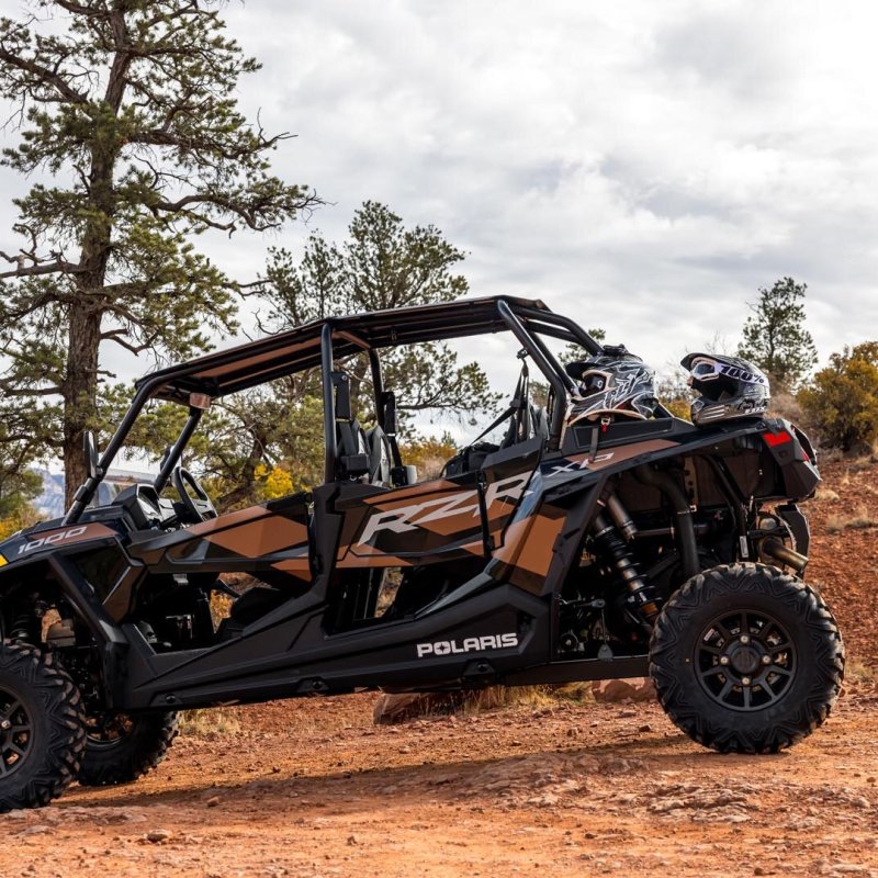 a truck driving down a dirt road