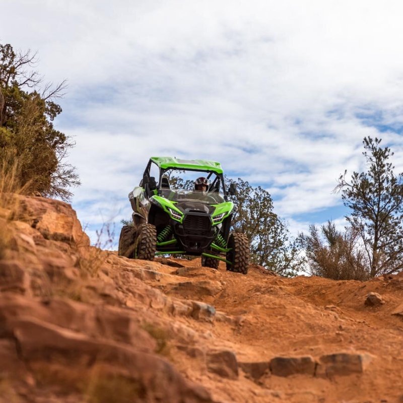 a person standing on a rocky hill