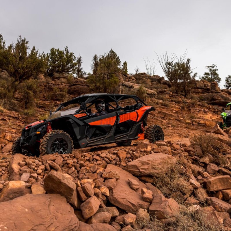 a truck that is sitting on a rock