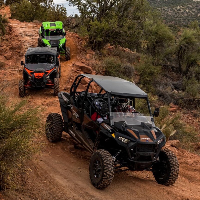 a truck driving down a dirt road