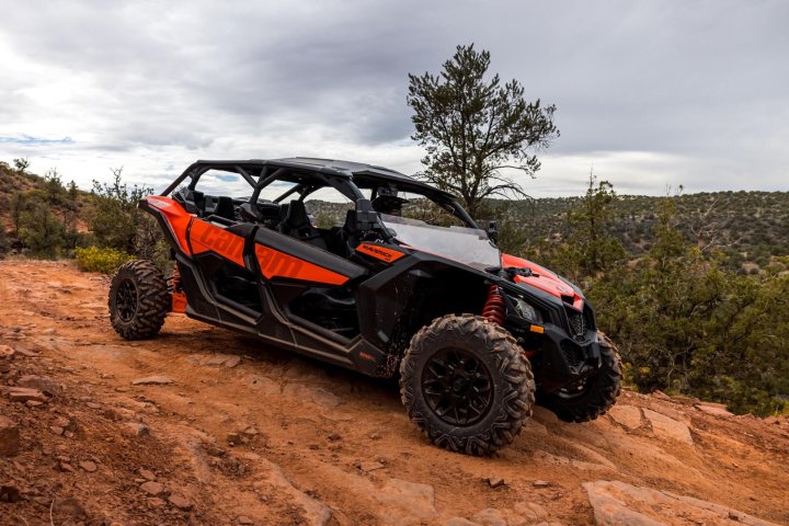 a car driving down a dirt road