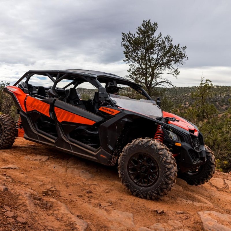 a car driving down a dirt road